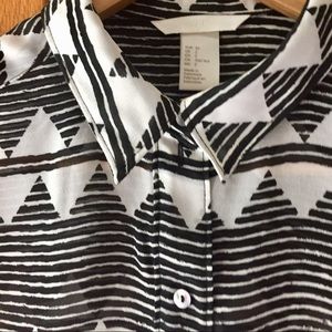 Sleeveless sheer black and white blouse